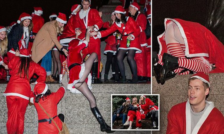 Пьяный «Santacon» в Лондоне Пьяный «Santacon» в Лондоне